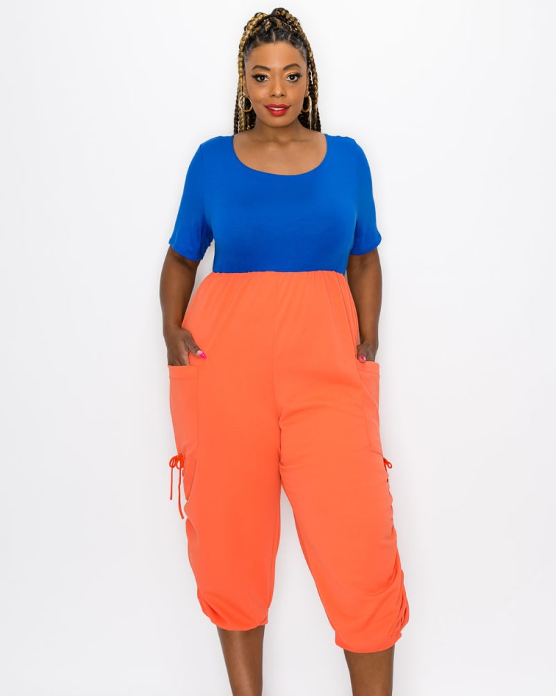 Front of a model wearing a size 1X Eliza Colorblock Jumpsuit in Royal/Orange by L I V D. | dia_product_style_image_id:240741